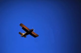 depositphotos_51783283-stock-photo-retro-biplane-aircraft-against-the